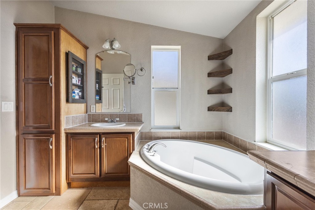 990 Mesa Valley Road Lebec, CA 93243 - Photo 17 of 38 a bath tub sitting next to a bathroom sink
