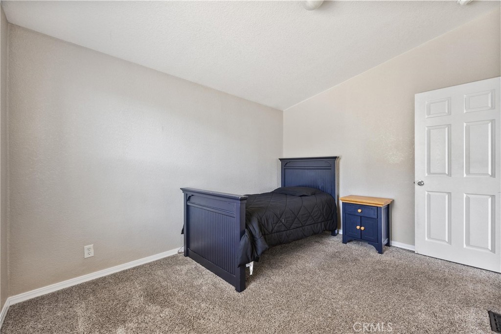 990 Mesa Valley Road Lebec, CA 93243 - Photo 18 of 38 a bedroom with a bed and furniture