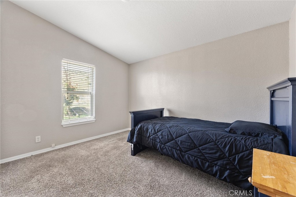990 Mesa Valley Road Lebec, CA 93243 - Photo 19 of 38 a bed sitting in a bedroom next to a window