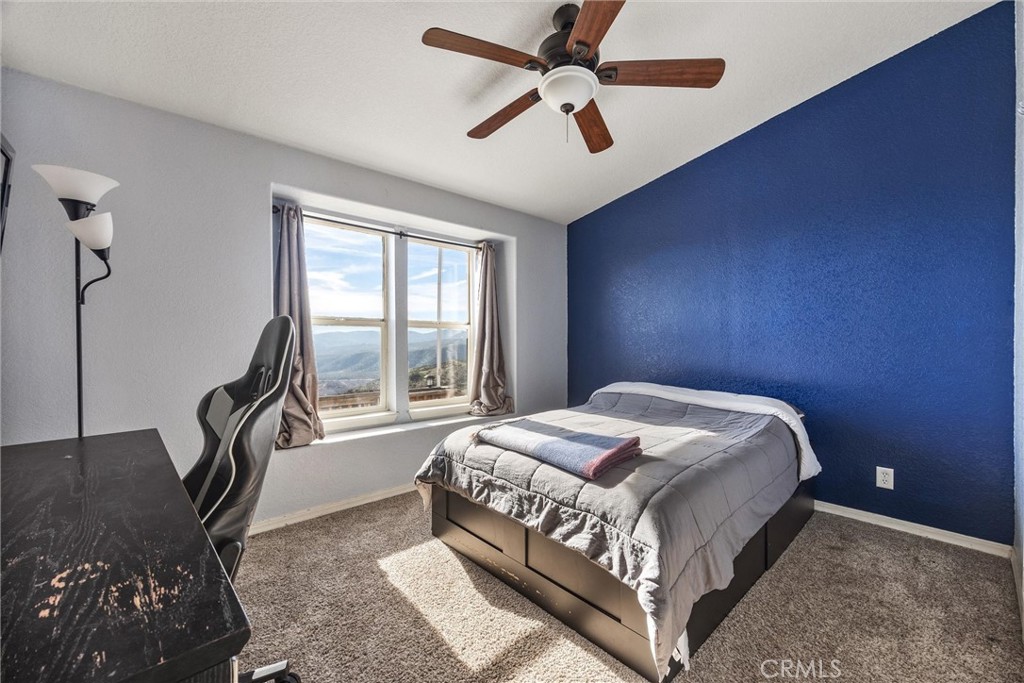 990 Mesa Valley Road Lebec, CA 93243 - Photo 21 of 38 a bed sitting in a bedroom next to a window