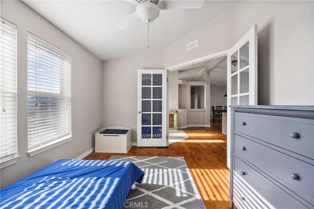 990 Mesa Valley Road Lebec, CA 93243 - Photo 24 of 38 a bedroom with a bed and wooden floor