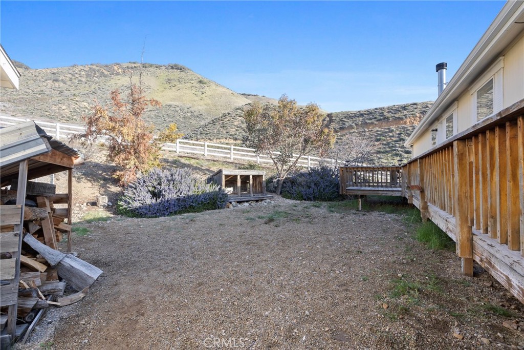 990 Mesa Valley Road Lebec, CA 93243 - Photo 30 of 38 a view of a house with a backyard
