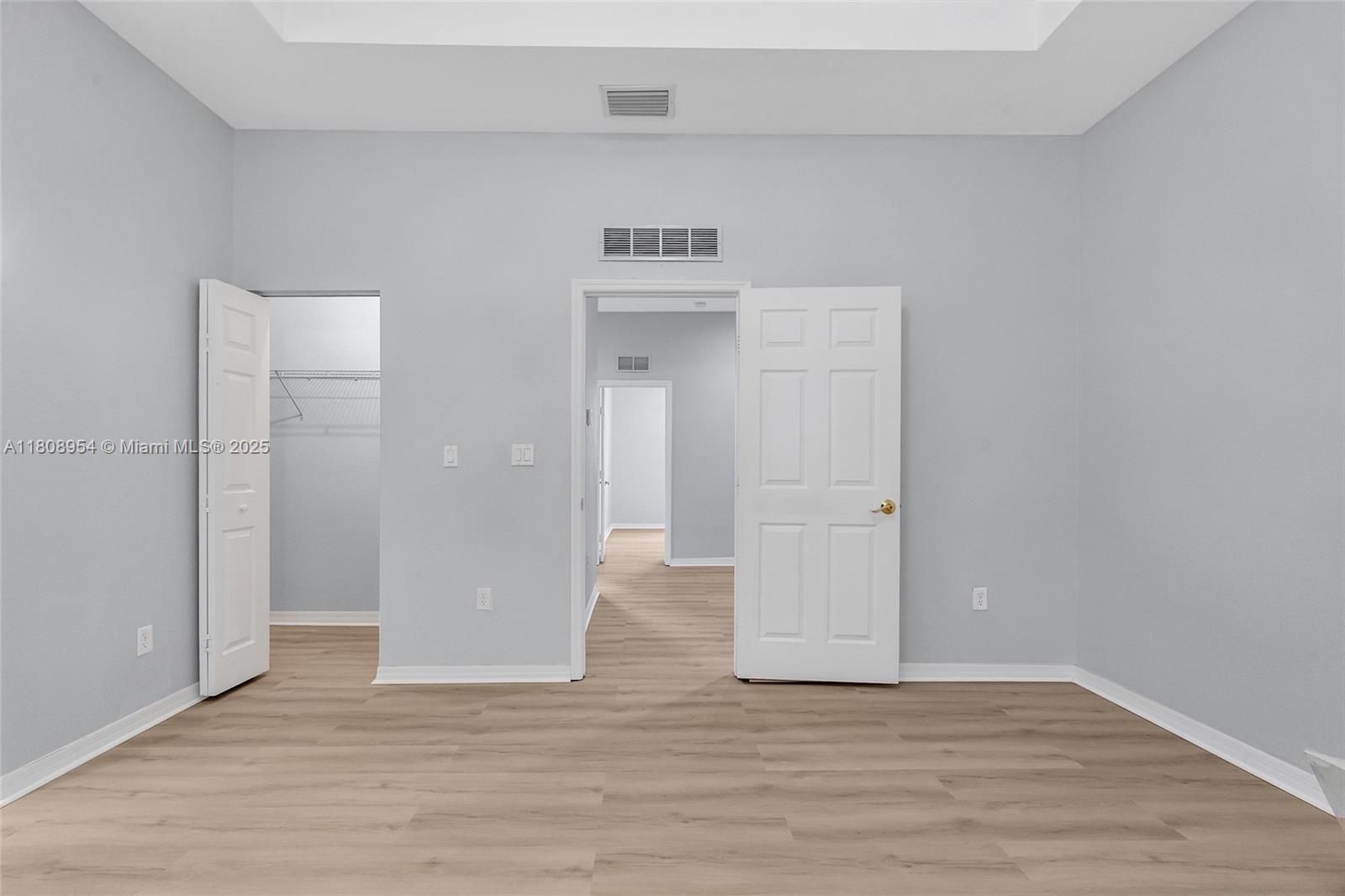 14059 Southwest 49th Street, Unit 4 Miramar, FL 33027 - Photo 16 of 29 a view of an empty room with wooden floor and closet