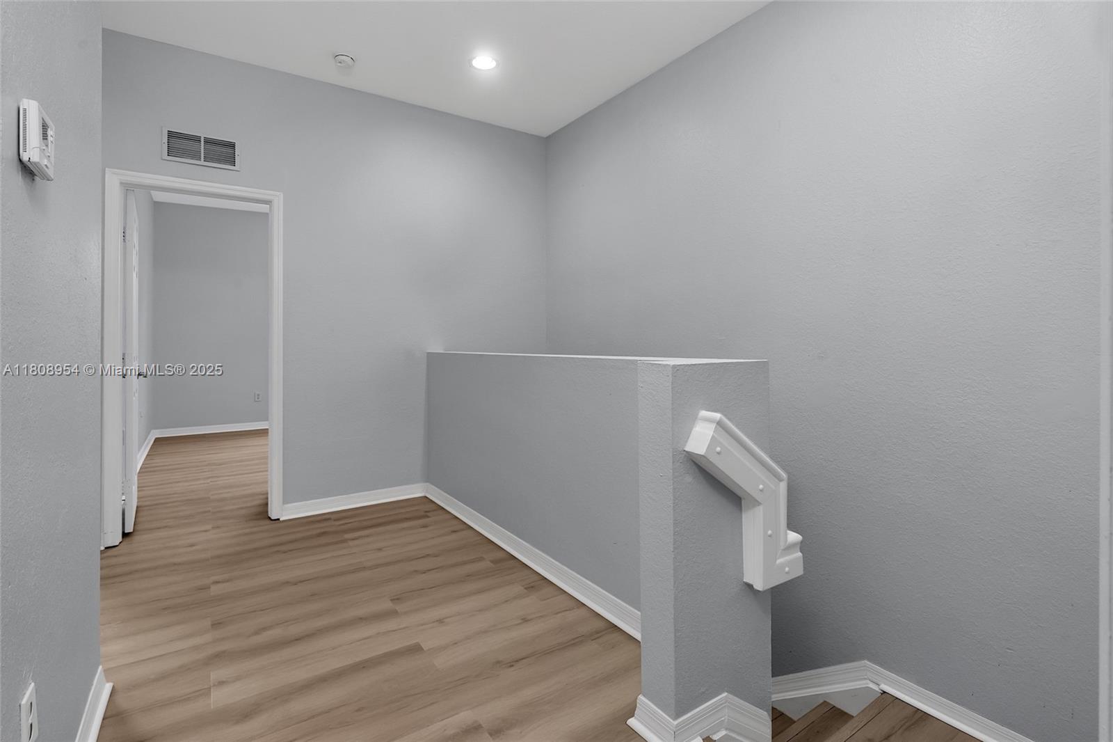 14059 Southwest 49th Street, Unit 4 Miramar, FL 33027 - Photo 21 of 29 wooden floor in an empty room