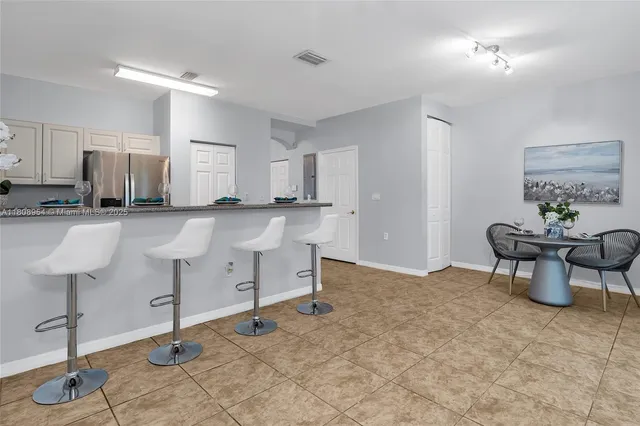 a view of kitchen with furniture and counter space