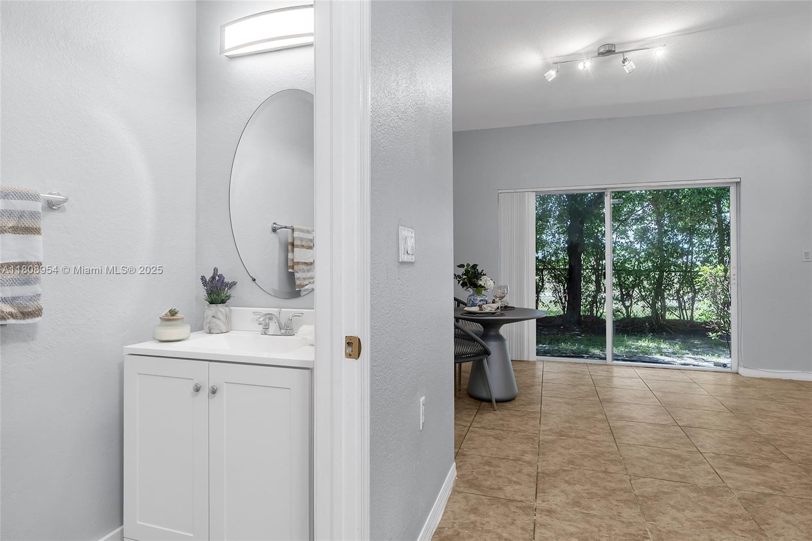 14059 Southwest 49th Street, Unit 4 Miramar, FL 33027 - Photo 9 of 29 a bathroom with a sink and a mirror