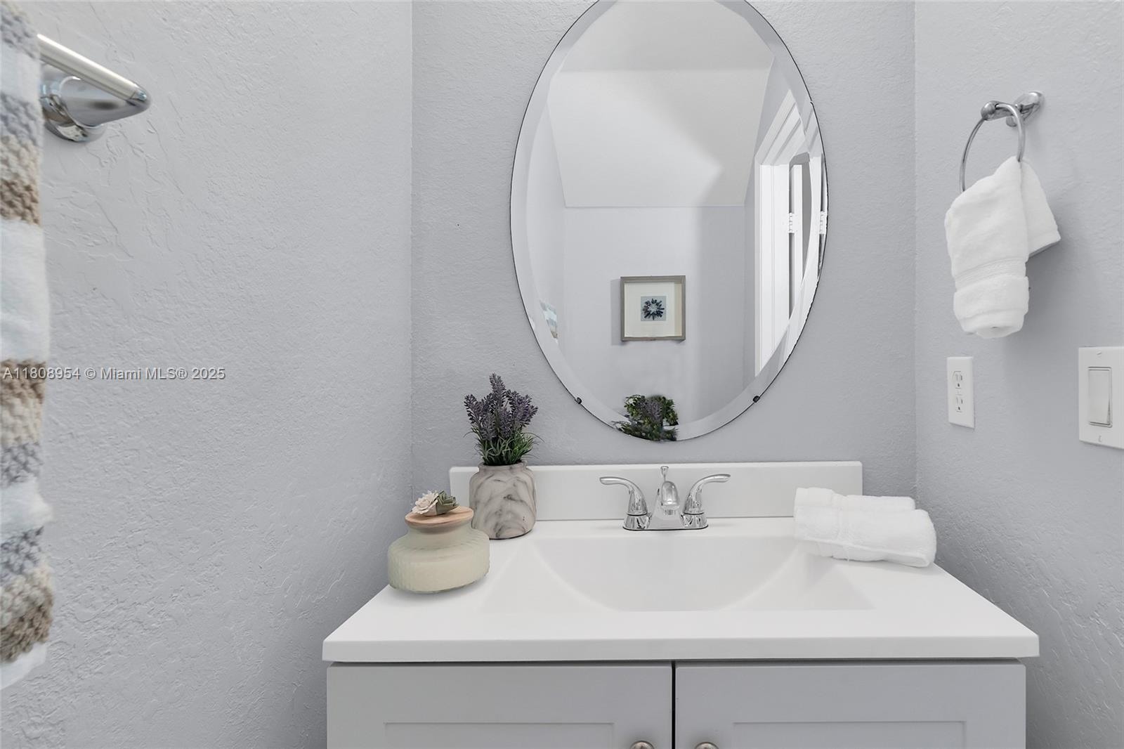 14059 Southwest 49th Street, Unit 4 Miramar, FL 33027 - Photo 10 of 29 a bathroom with a sink and a mirror