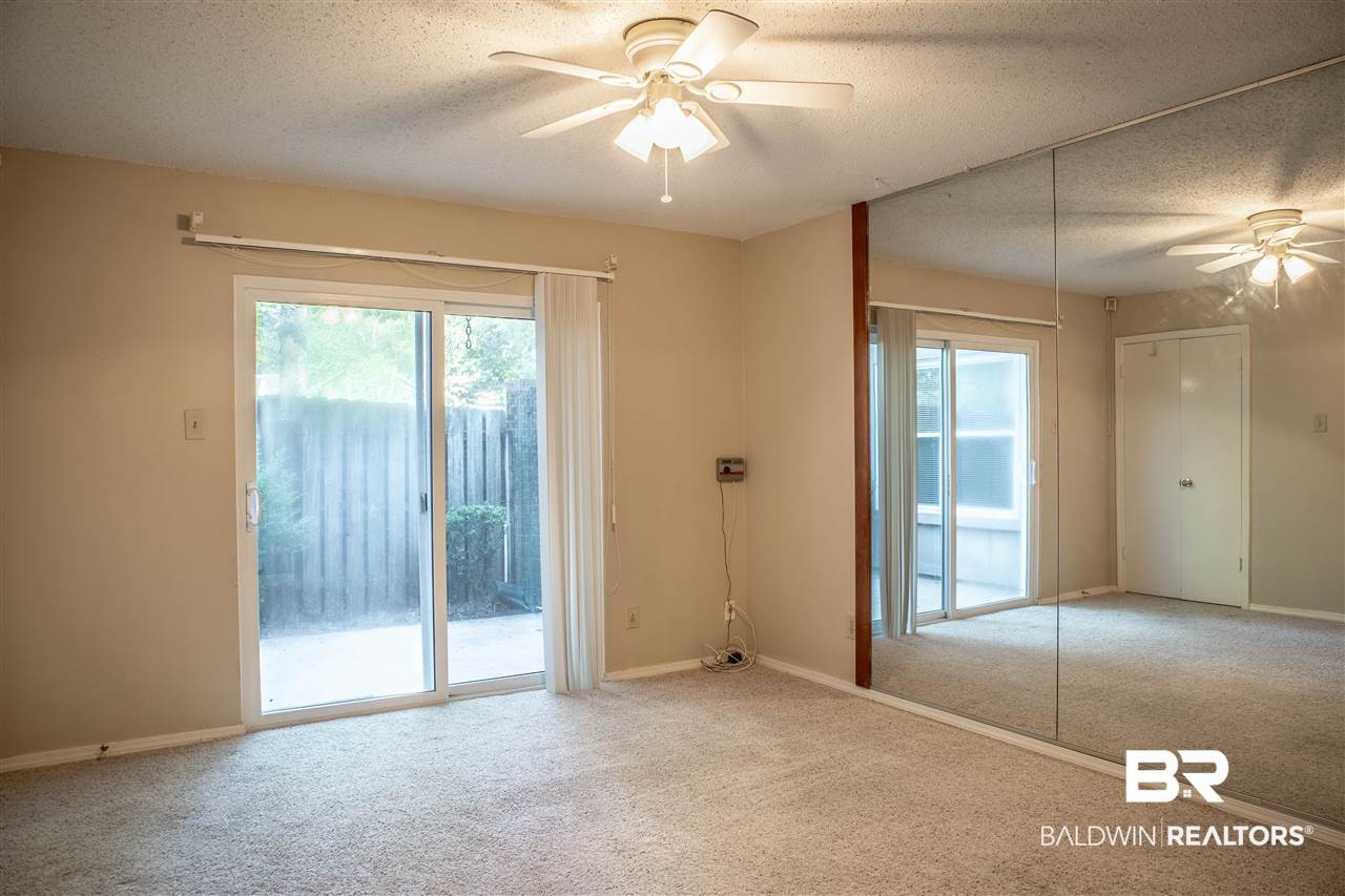 1831 Spring Brook Court Mobile, AL 36609 - Photo 16 of 28 Main level oversized bedroom with private patio.