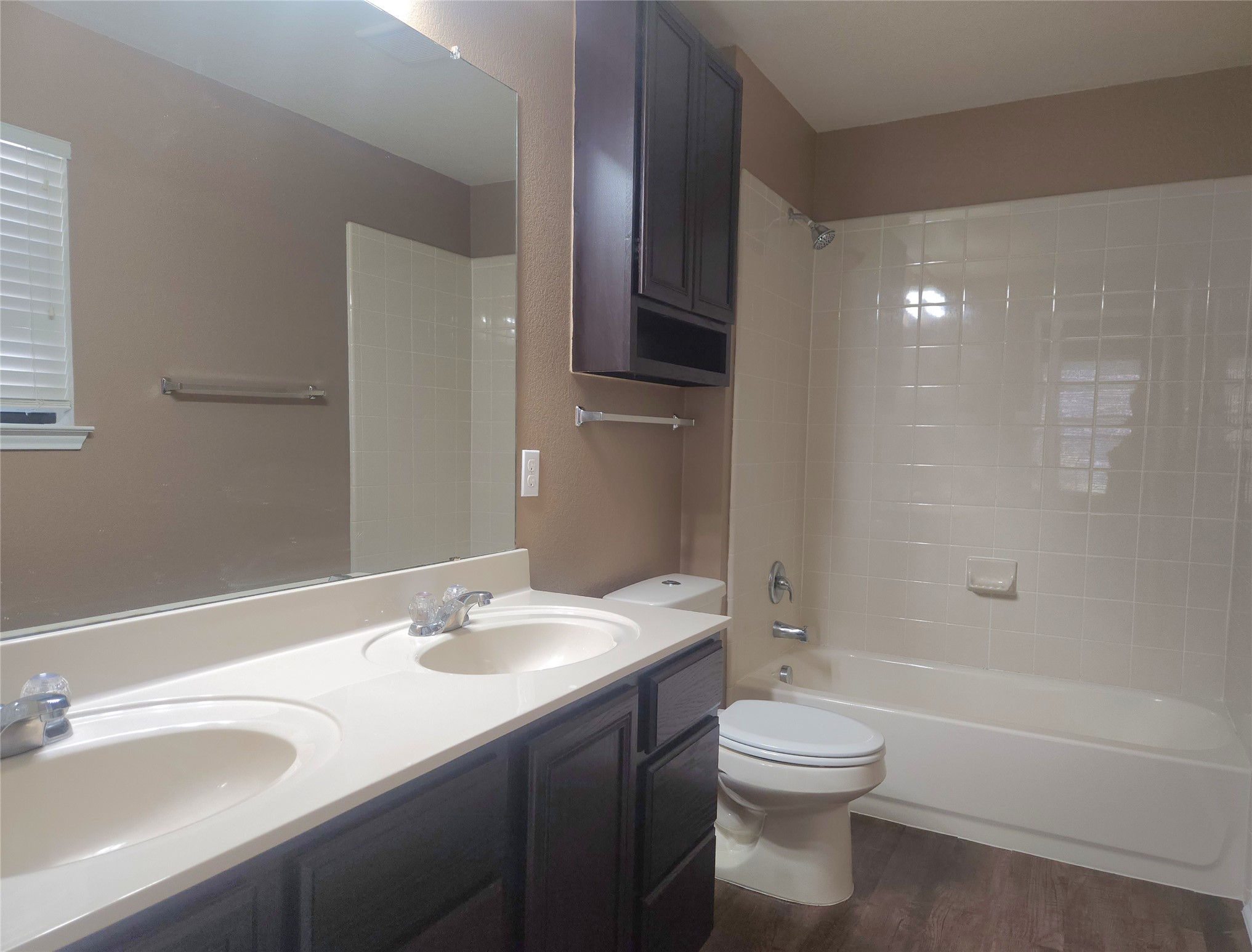 160 Rummel Drive Kyle, TX 78640 - Photo 6 of 13 Two individual sinks complement the bathroom's full shower and tub.