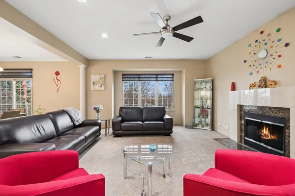 a living room with furniture and a fireplace