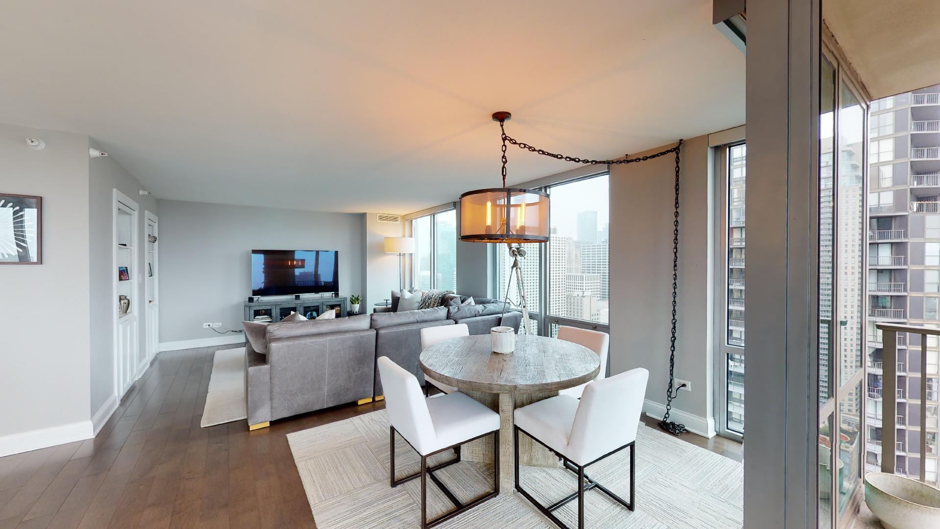 2 East Erie Street, Unit 3605 Chicago, IL 60611 - Photo 11 of 30 a view of a dining room with furniture window and outside view