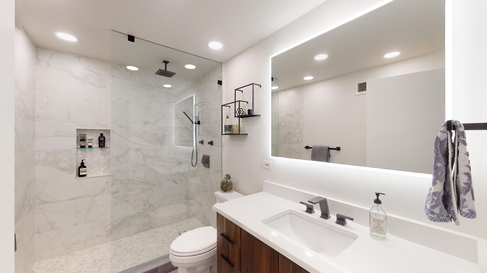 2 East Erie Street, Unit 3605 Chicago, IL 60611 - Photo 19 of 30 a bathroom with a sink toilet double vanity and shower