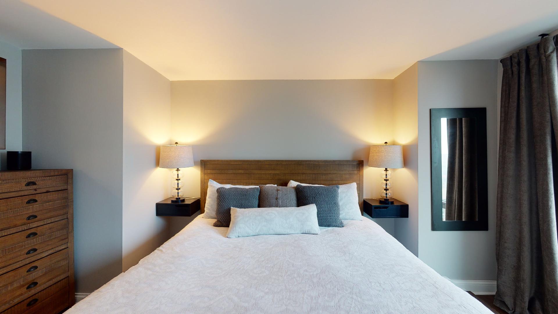 2 East Erie Street, Unit 3605 Chicago, IL 60611 - Photo 21 of 30 a bed room with a bed and a night stand