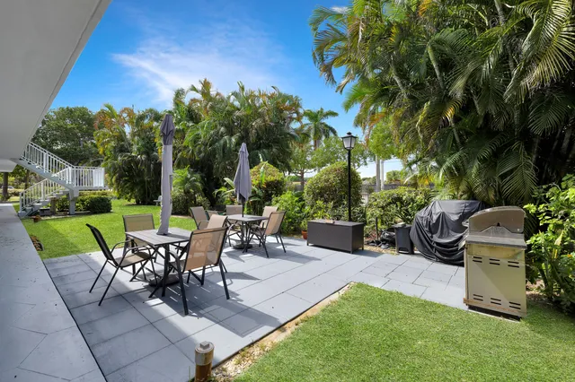 a view of an chairs and tables in the patio