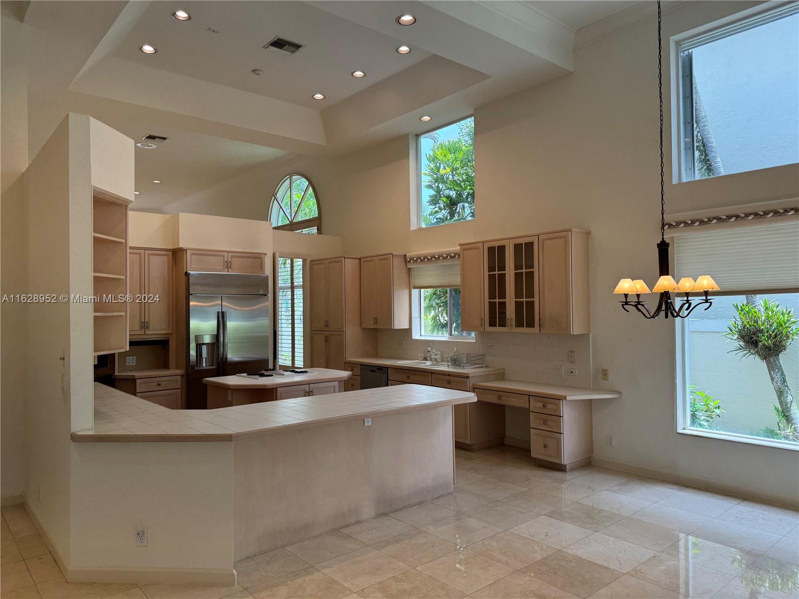 2743 Pinehurst Drive Weston, FL 33332 - Photo 15 of 35 a large kitchen with stainless steel appliances a large counter top