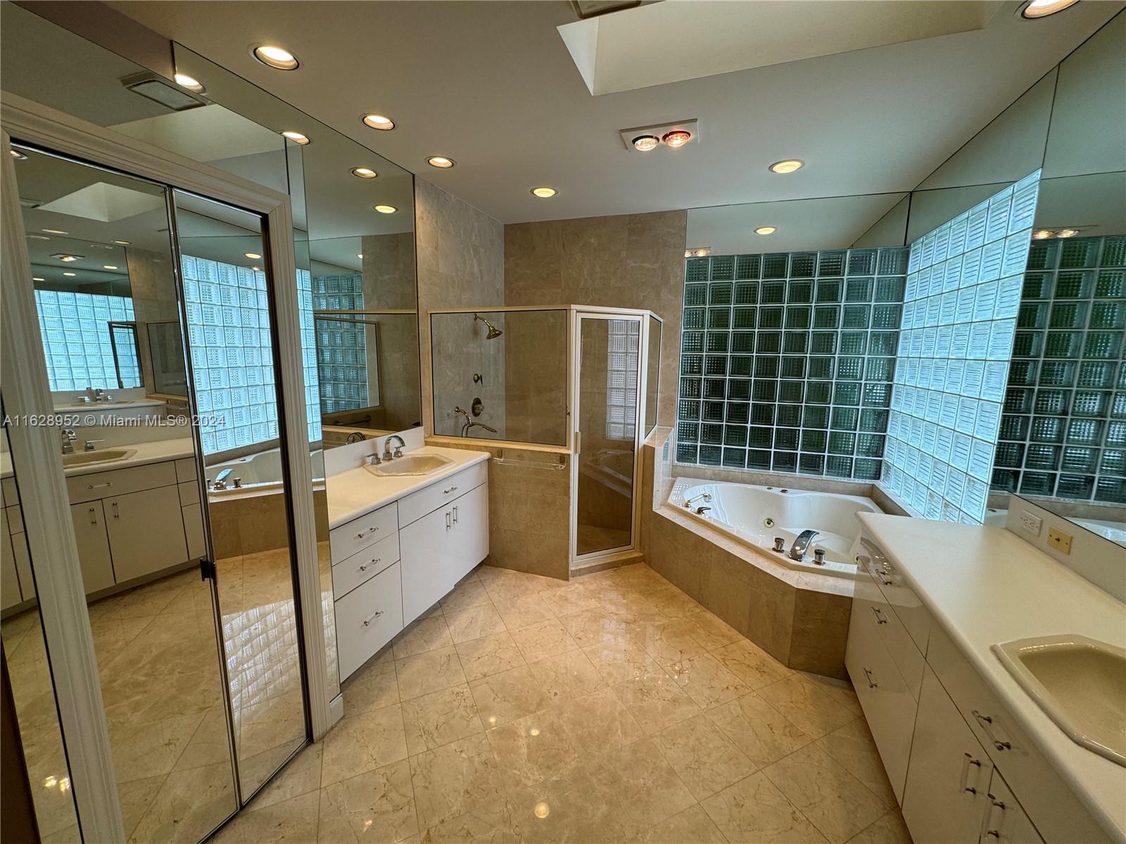 2743 Pinehurst Drive Weston, FL 33332 - Photo 24 of 35 a bathroom with a tub a sink a mirror and a shower