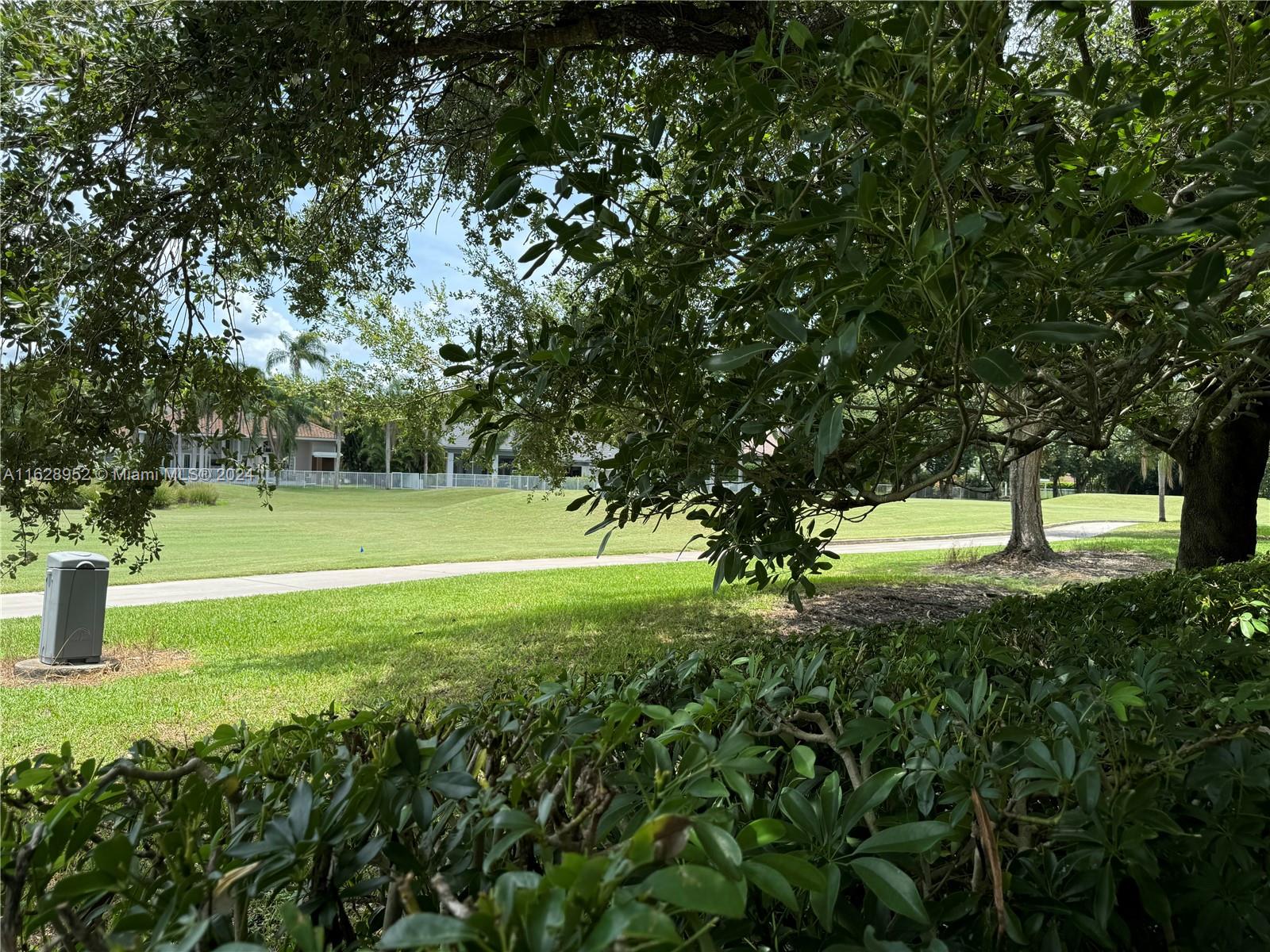 2743 Pinehurst Drive Weston, FL 33332 - Photo 34 of 35 a view of a house with a yard