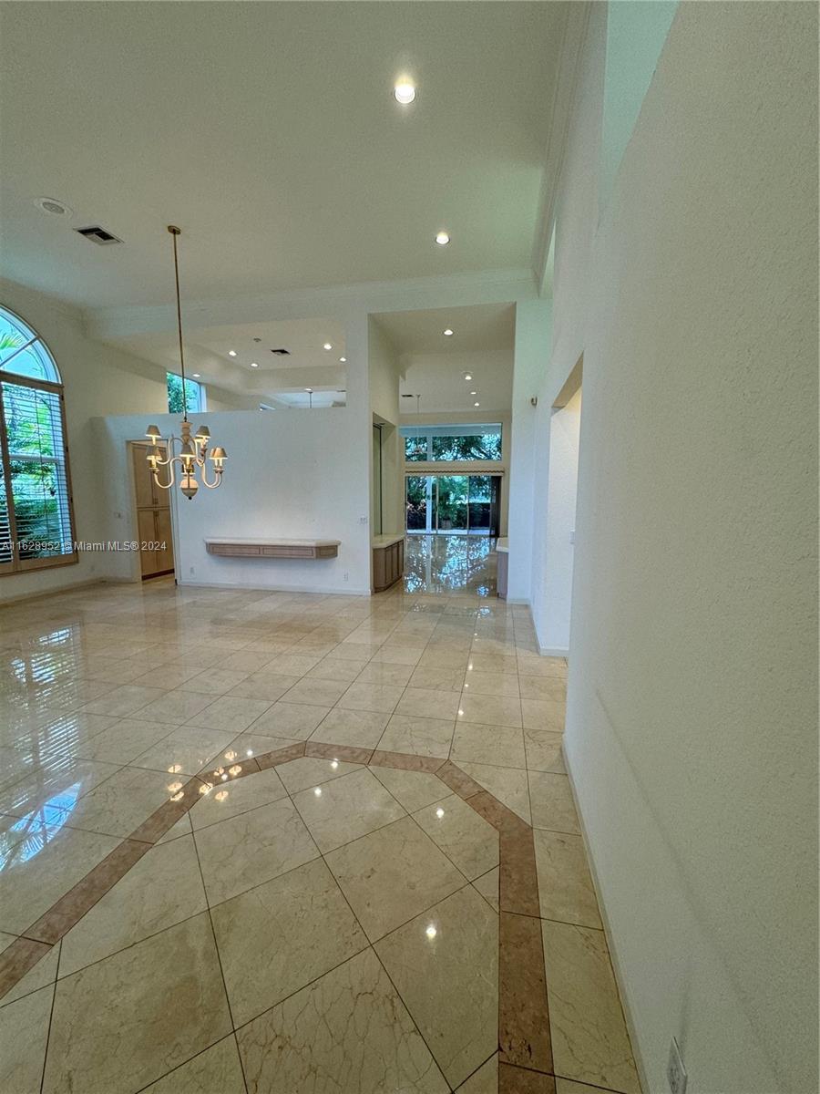 2743 Pinehurst Drive Weston, FL 33332 - Photo 4 of 35 a lobby with furniture and a chandelier