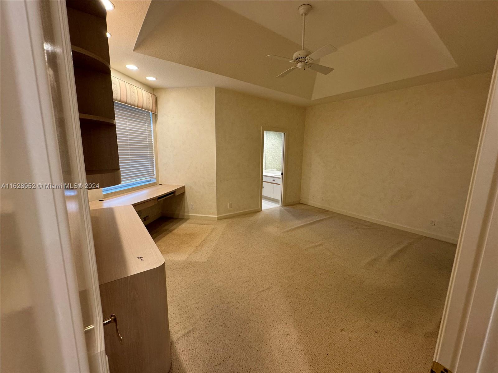 2743 Pinehurst Drive Weston, FL 33332 - Photo 10 of 35 a view of an empty room with a fireplace