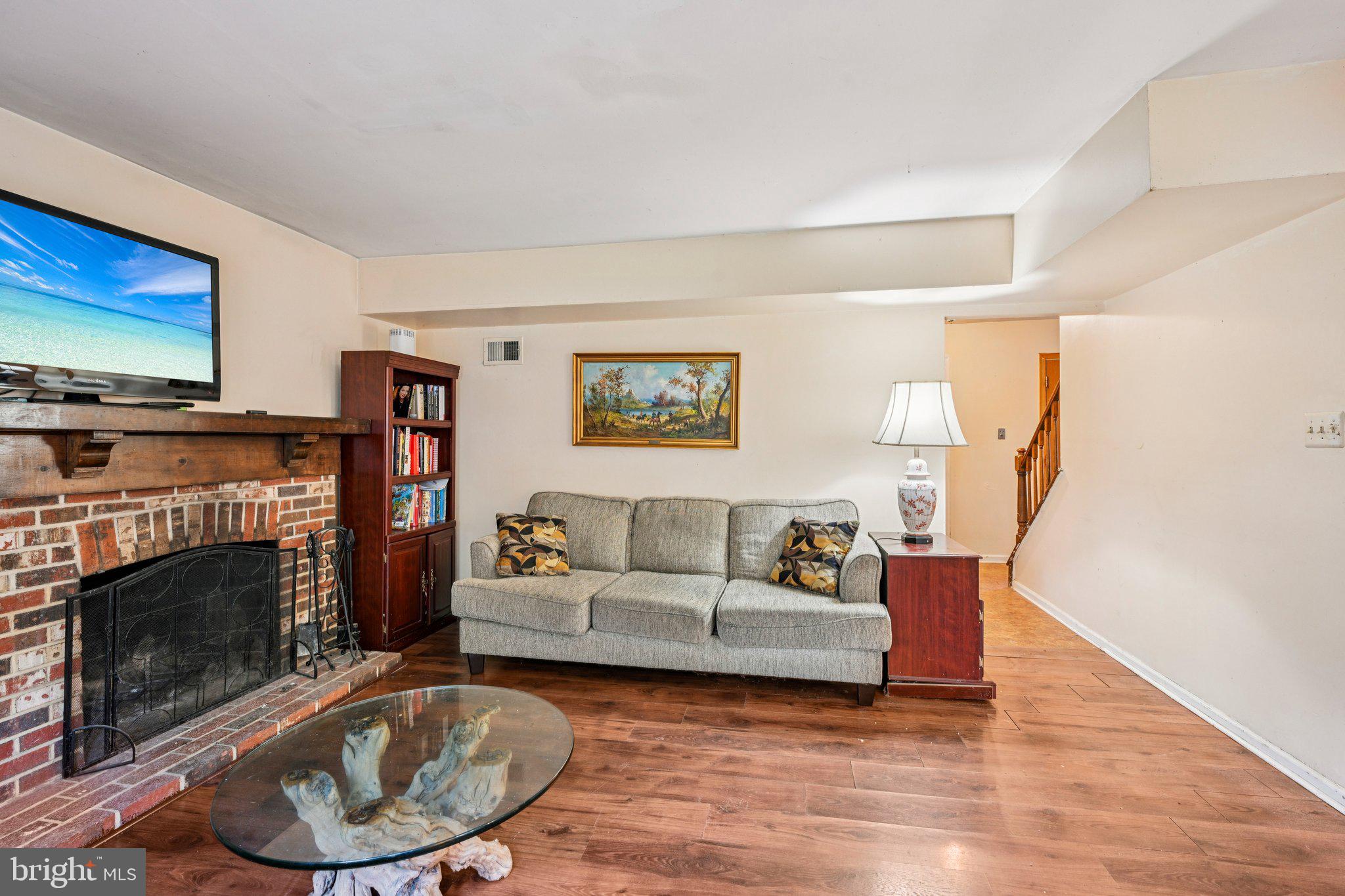 13 Tarnsfield Road Westampton, NJ 08060 - Photo 8 of 44 a living room with furniture and a fireplace