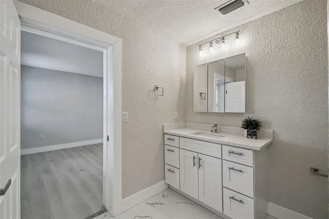 a view of a bathroom from the hallway