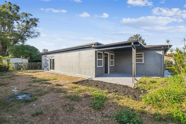 an aerial view of a house with a garden