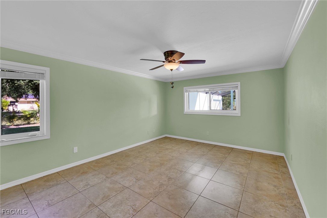 17040 Pleasure Road Cape Coral, FL 33909 - Photo 16 of 38 a view of an empty room with a window