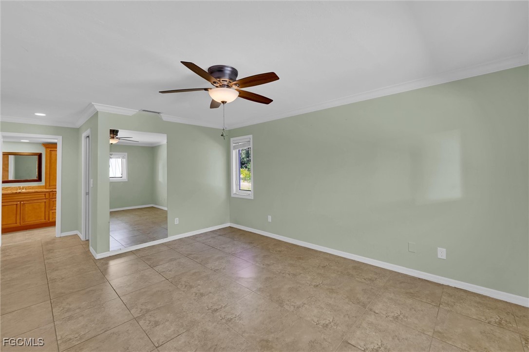 17040 Pleasure Road Cape Coral, FL 33909 - Photo 17 of 38 an empty room with a empty space and windows
