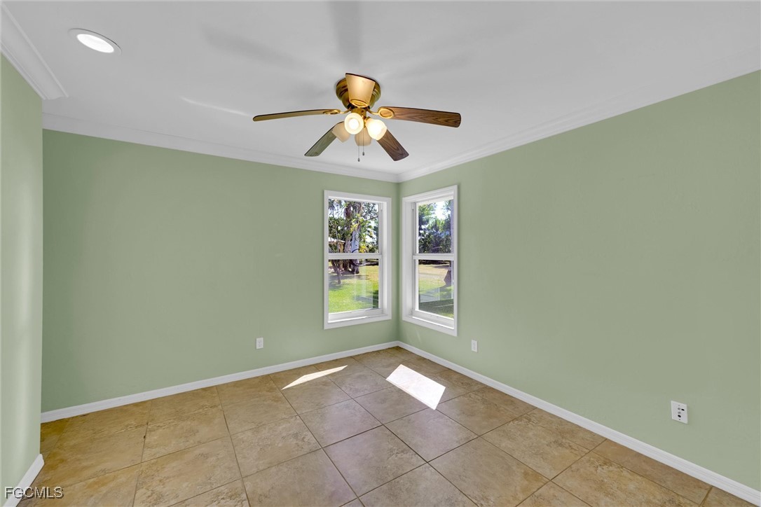 17040 Pleasure Road Cape Coral, FL 33909 - Photo 23 of 38 a view of an empty room with a window