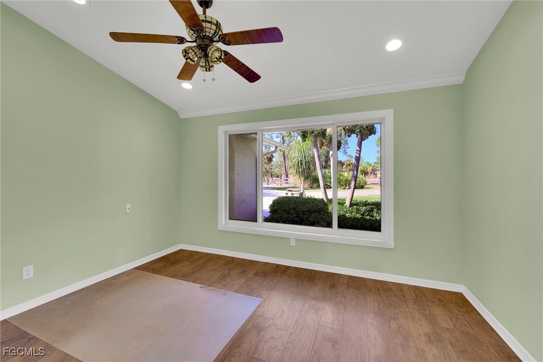17040 Pleasure Road Cape Coral, FL 33909 - Photo 26 of 38 a view of room with window ceiling fan and hardwood floor