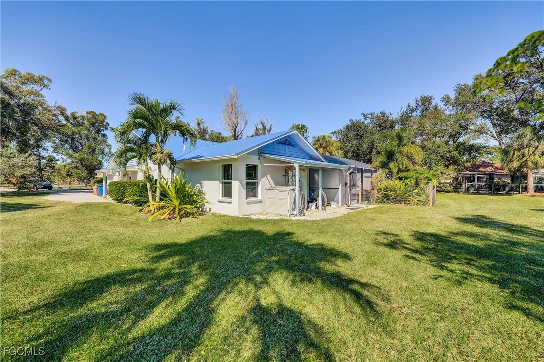 17040 Pleasure Road Cape Coral, FL 33909 - Photo 32 of 38 a view of house with garden