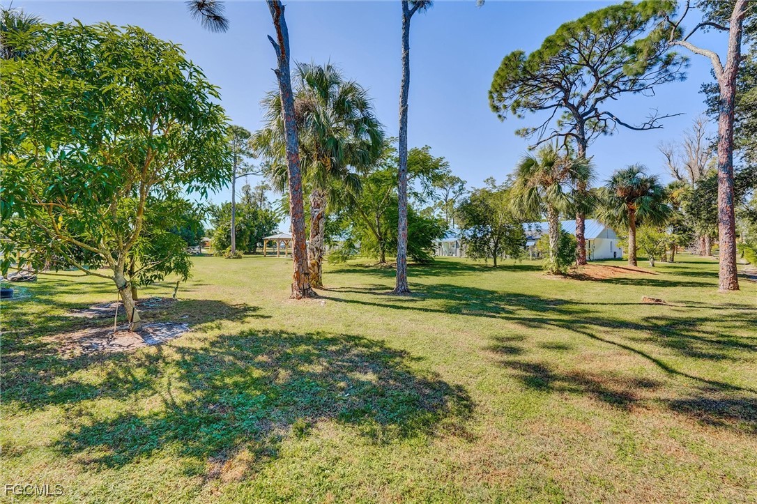 17040 Pleasure Road Cape Coral, FL 33909 - Photo 35 of 38 a view of a playground with basketball court