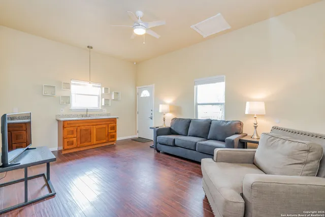 a living room with furniture and a flat screen tv