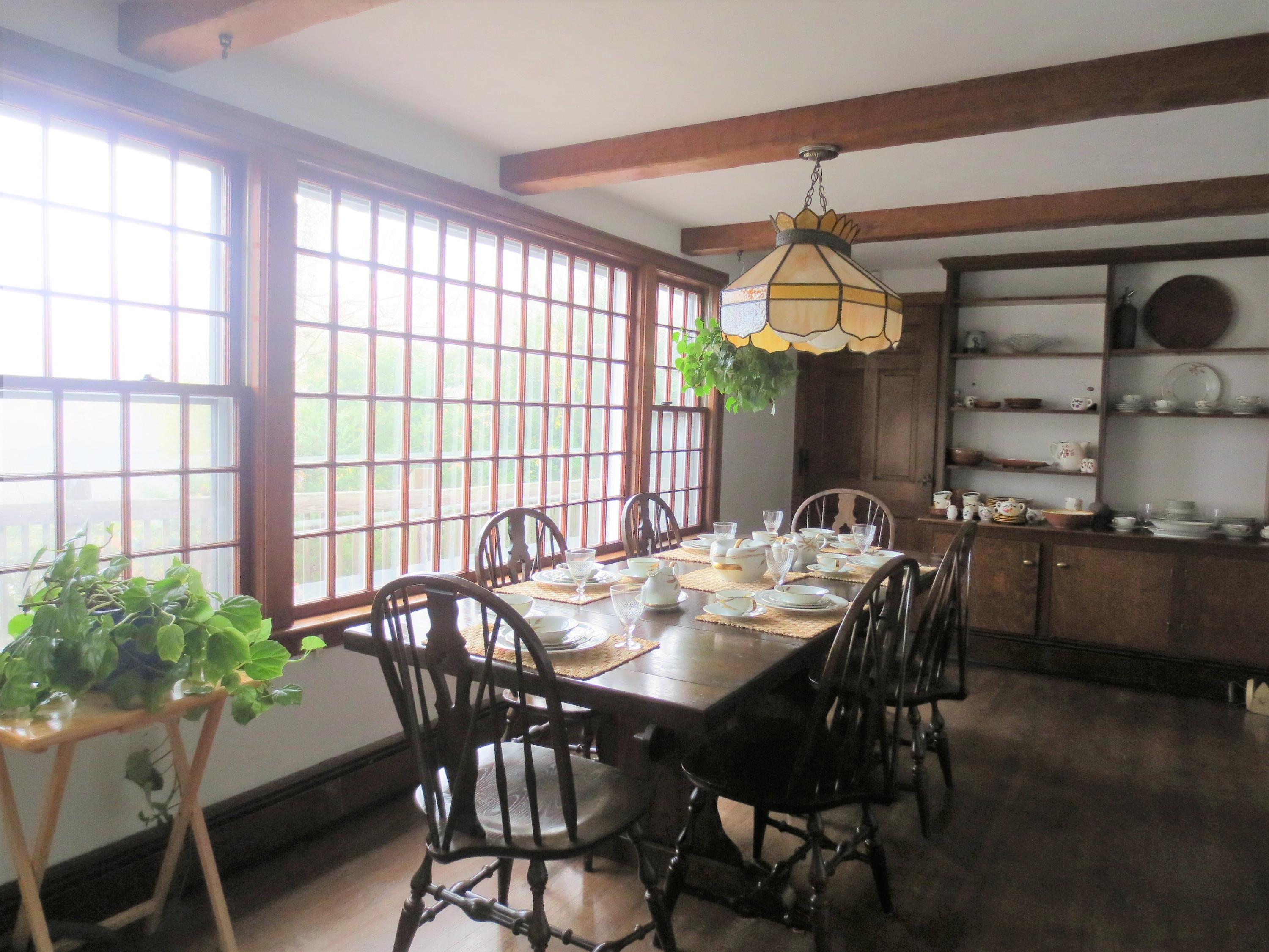 212 Holly Point Road Centerville, MA 02632 - Photo 18 of 30 a view of a dining room with furniture and window