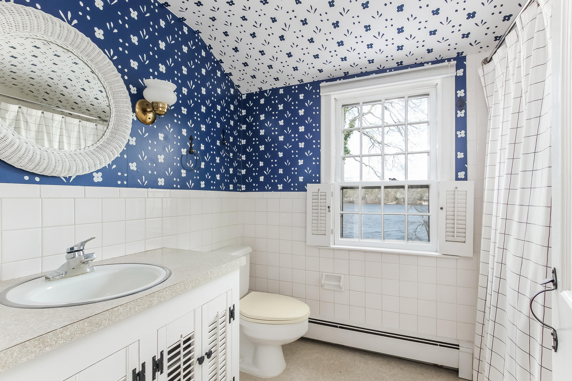 212 Holly Point Road Centerville, MA 02632 - Photo 23 of 30 a bathroom with a sink a toilet and a mirror