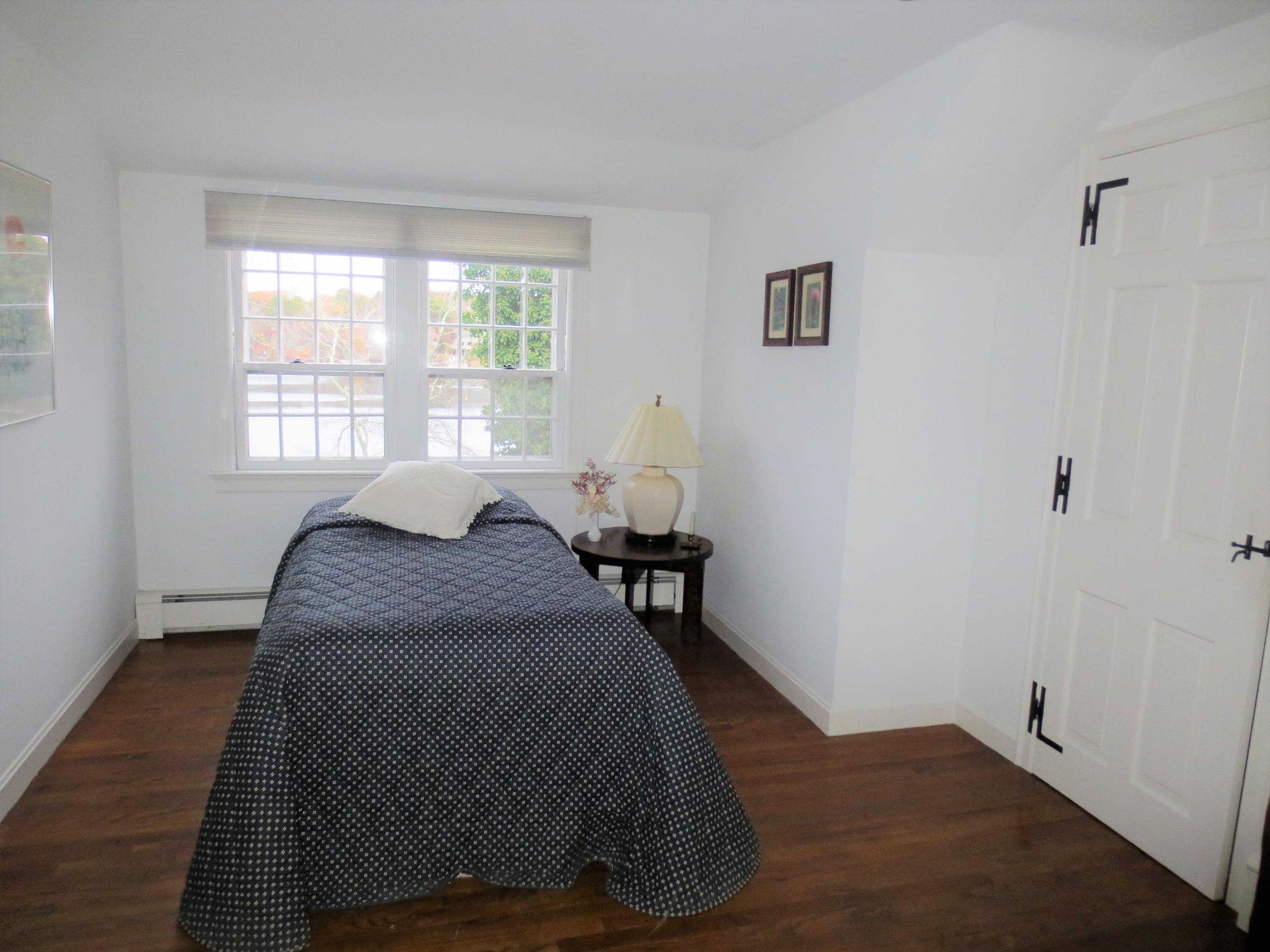212 Holly Point Road Centerville, MA 02632 - Photo 24 of 30 a bedroom with a bed and window