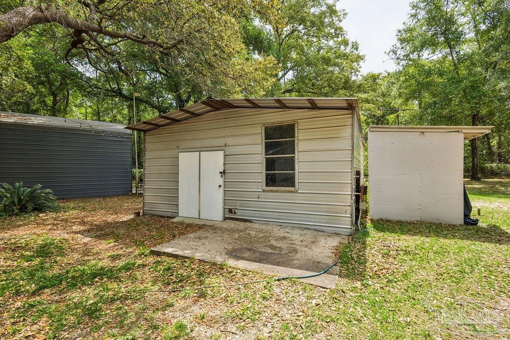 8938 Pioneer Road Holt, FL 32564 - Photo 35 of 44 a view of a backyard
