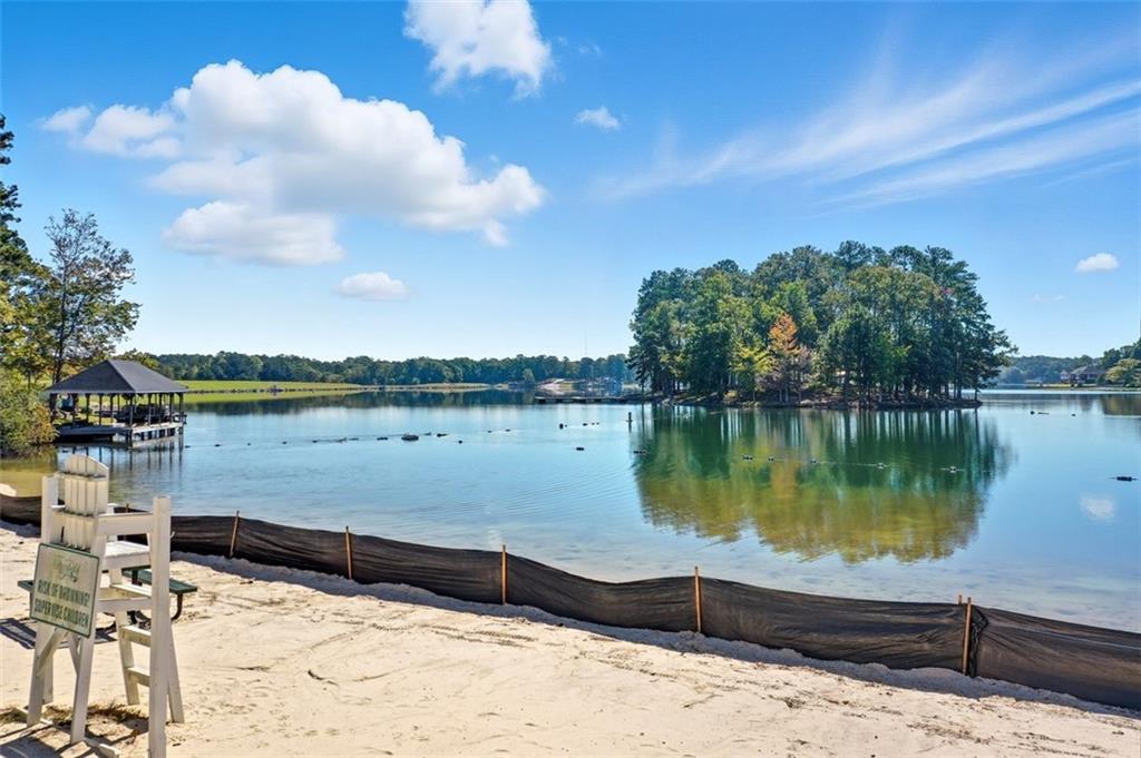 2021 Lakeview Parkway Villa Rica, GA 30180 - Photo 104 of 112 a view of a lake with a house in the background