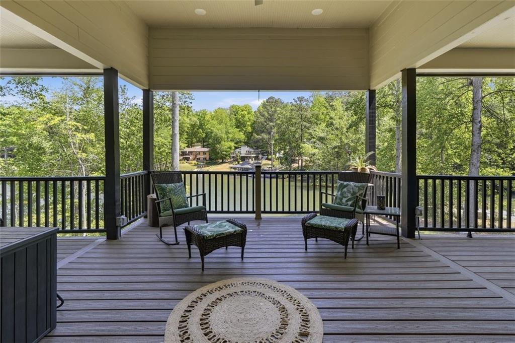 2021 Lakeview Parkway Villa Rica, GA 30180 - Photo 13 of 112 a balcony with wooden floor table and chairs