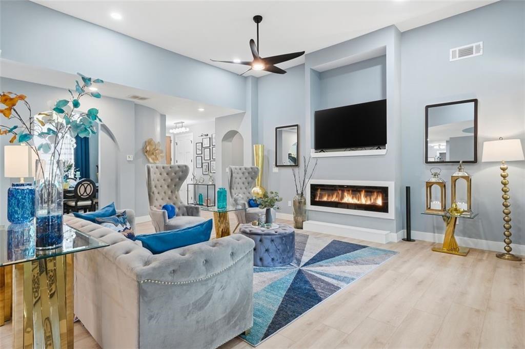 2021 Lakeview Parkway Villa Rica, GA 30180 - Photo 20 of 112 a living room with furniture a fireplace and a flat screen tv