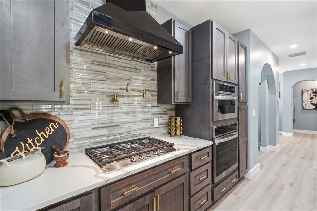 2021 Lakeview Parkway Villa Rica, GA 30180 - Photo 31 of 112 a kitchen with a stove and a refrigerator