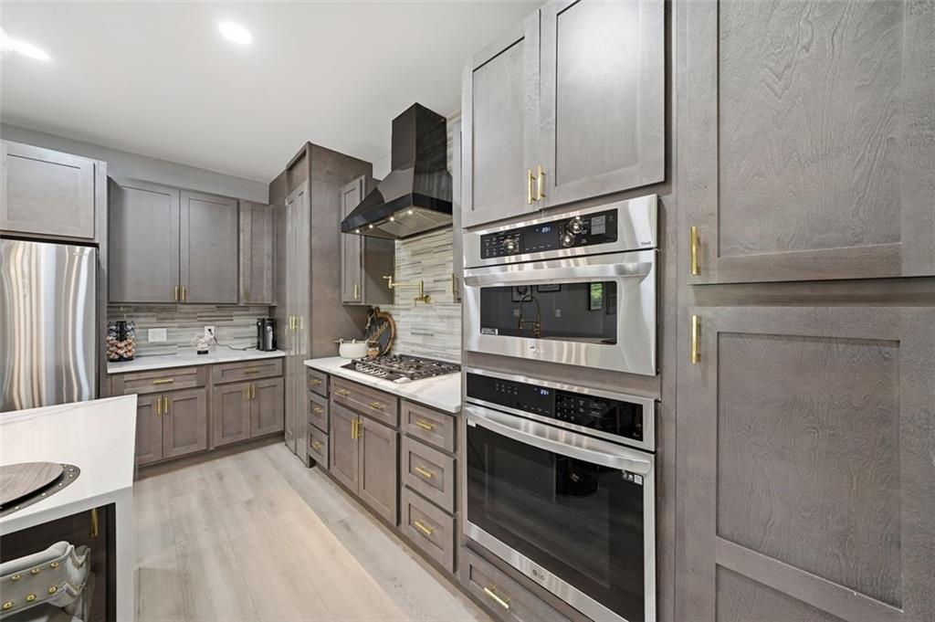 2021 Lakeview Parkway Villa Rica, GA 30180 - Photo 32 of 112 a kitchen with a stove and a microwave