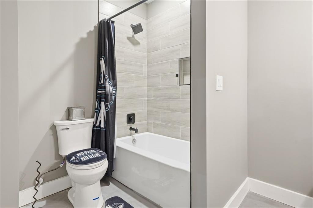 2021 Lakeview Parkway Villa Rica, GA 30180 - Photo 59 of 112 a bathroom with a toilet and a shower