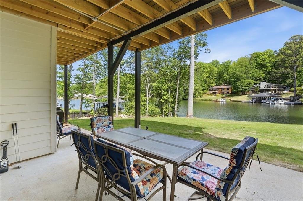2021 Lakeview Parkway Villa Rica, GA 30180 - Photo 65 of 112 a view of a patio with table and chairs under an umbrella