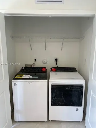 a utility room with washer and dryer