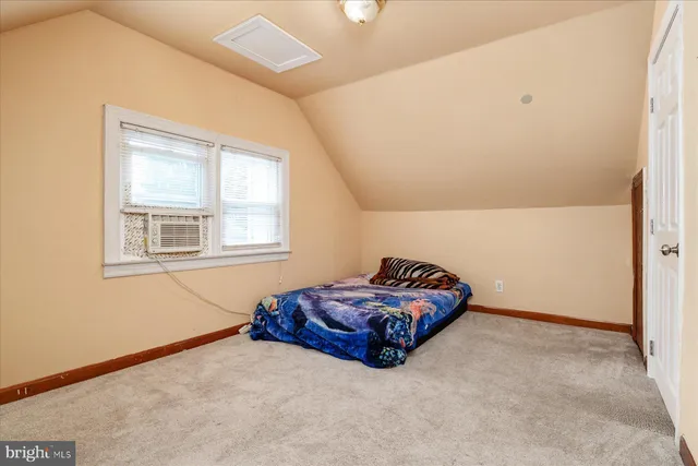 a living room with a couch and a window