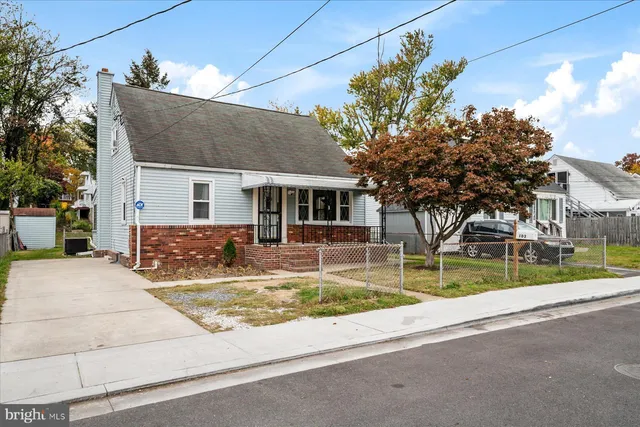 a view of house with outdoor space and tree s
