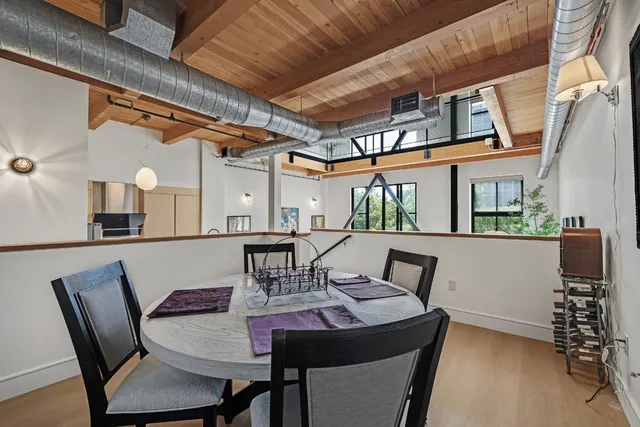 a view of an outside dining space with furniture