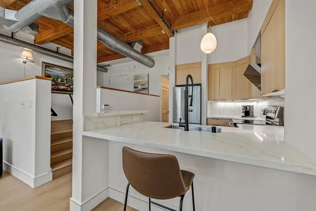 a kitchen with a table and chairs