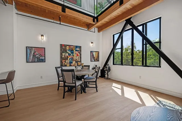 a view of a livingroom with furniture and staircase